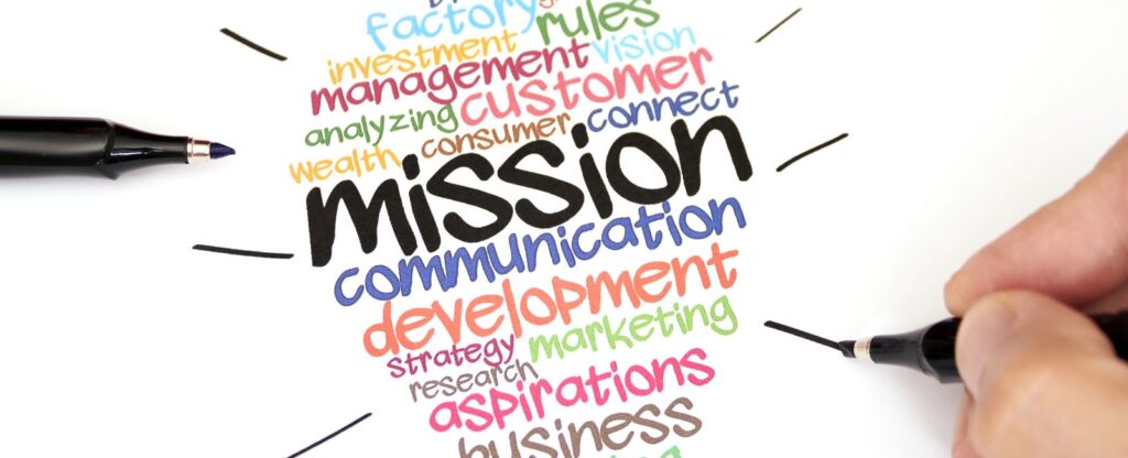 Colorful word cloud around the word 'mission' with various business-related terms.