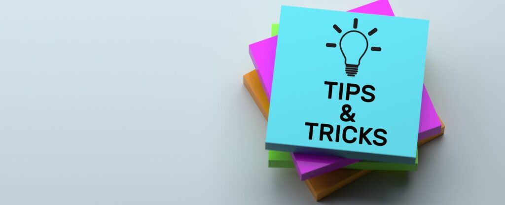 Stack of colorful sticky notes with 'Tips & Tricks' written on the top note, representing helpful advice for navigating Disney World with a service dog.